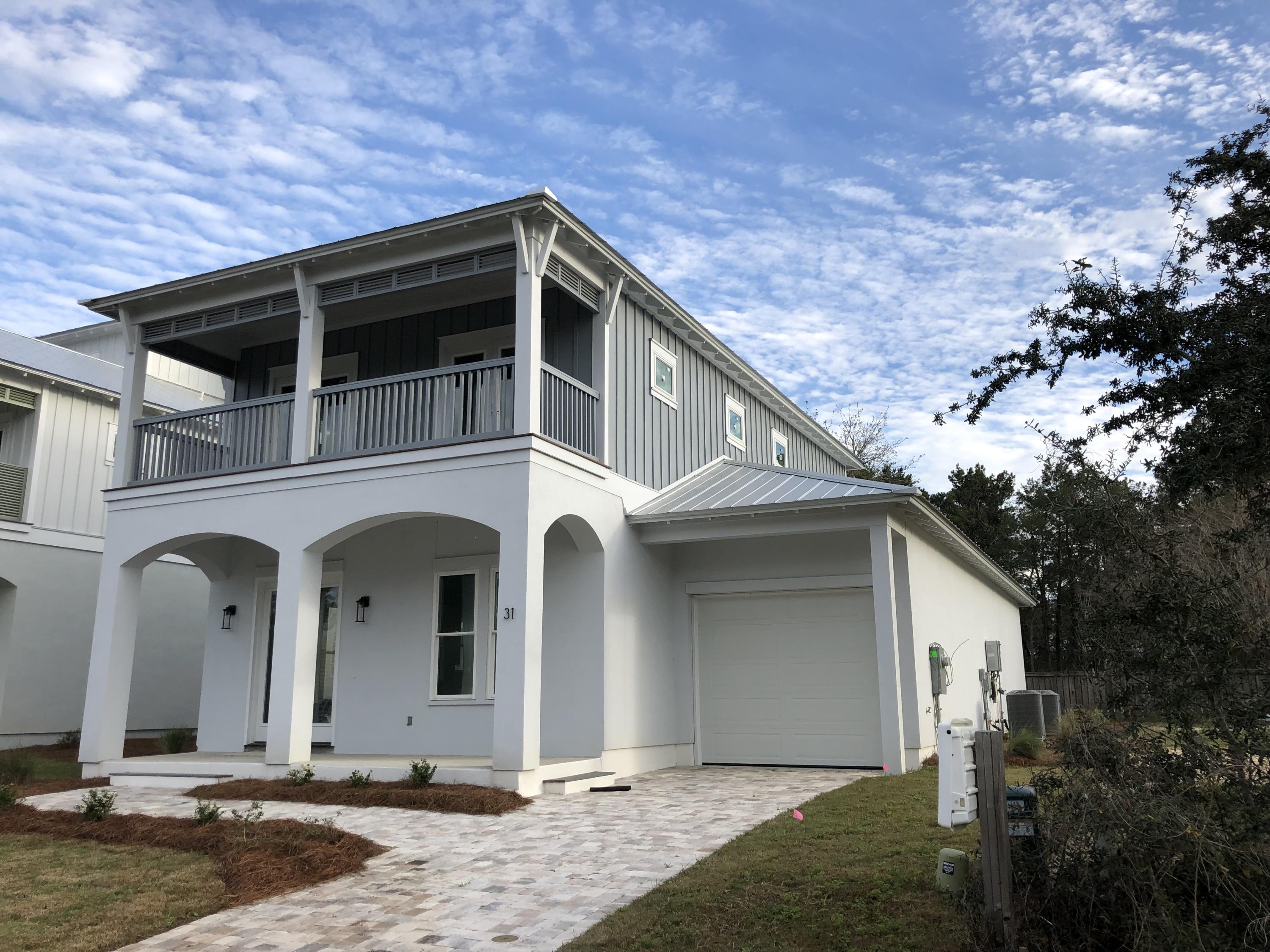 Lot 29 West Willow Mist Rd Inlet Beach Inlet Beach, FL 32461 - Photo 3 of 28 a front view of a house with garden