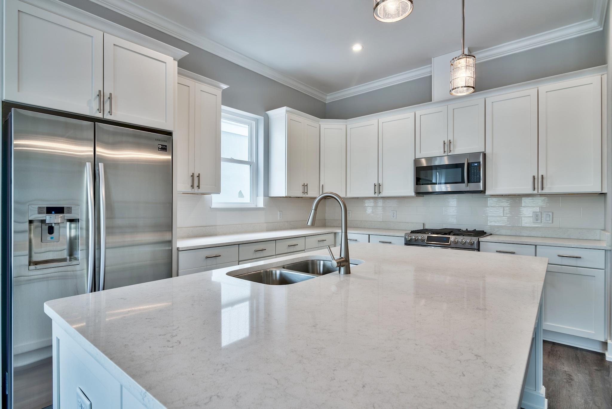 Lot 29 West Willow Mist Rd Inlet Beach Inlet Beach, FL 32461 - Photo 9 of 28 a kitchen with stainless steel appliances granite countertop a sink a stove and a refrigerator