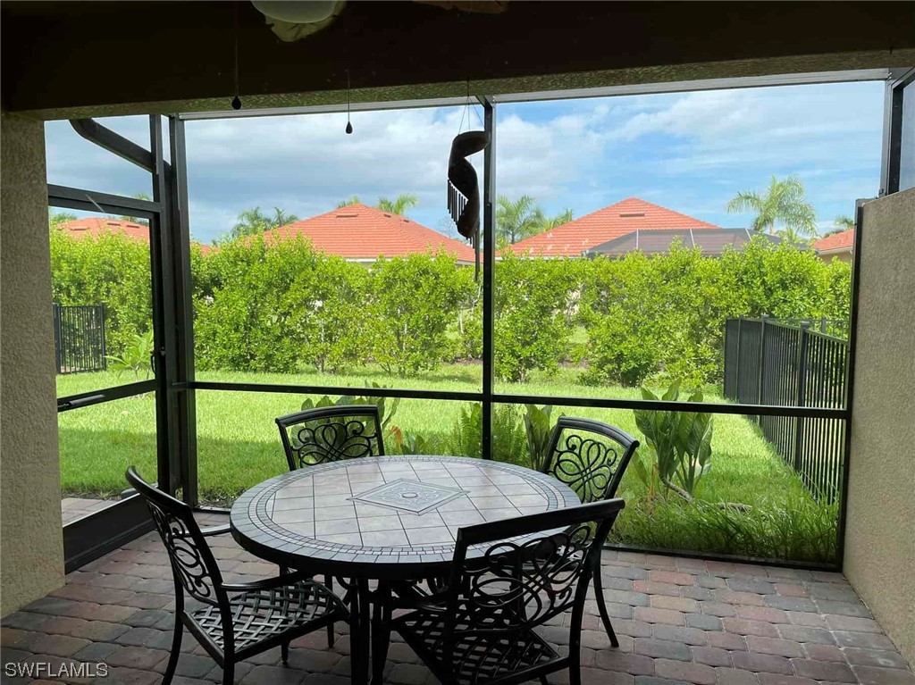 4369 Dutchess Park Road Fort Myers, FL 33916 - Photo 11 of 18 a view of a balcony with table and chairs
