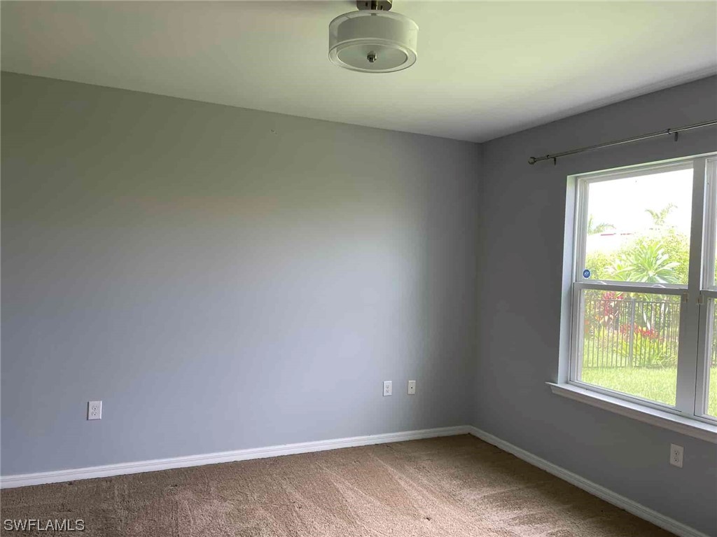 4369 Dutchess Park Road Fort Myers, FL 33916 - Photo 12 of 18 an empty room with a window