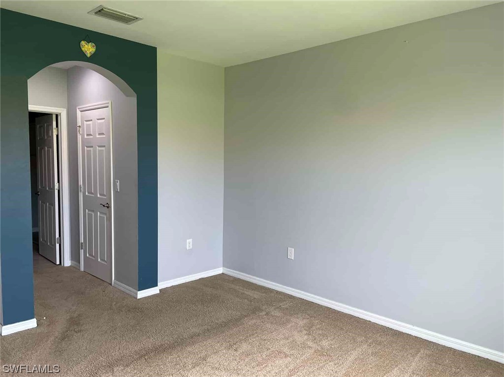 4369 Dutchess Park Road Fort Myers, FL 33916 - Photo 13 of 18 an empty room with windows and closet