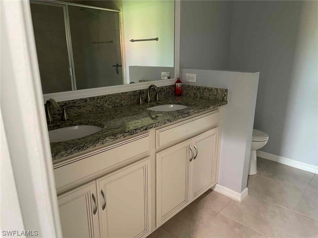 4369 Dutchess Park Road Fort Myers, FL 33916 - Photo 15 of 18 a bathroom with a sink and a mirror