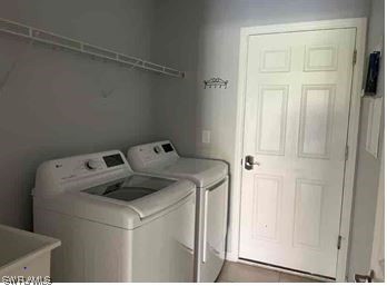 4369 Dutchess Park Road Fort Myers, FL 33916 - Photo 18 of 18 a utility room with dryer and washer
