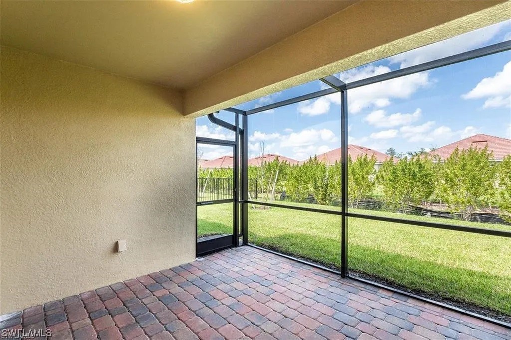 4369 Dutchess Park Road Fort Myers, FL 33916 - Photo 2 of 18 a view of a room with wooden floor and windows