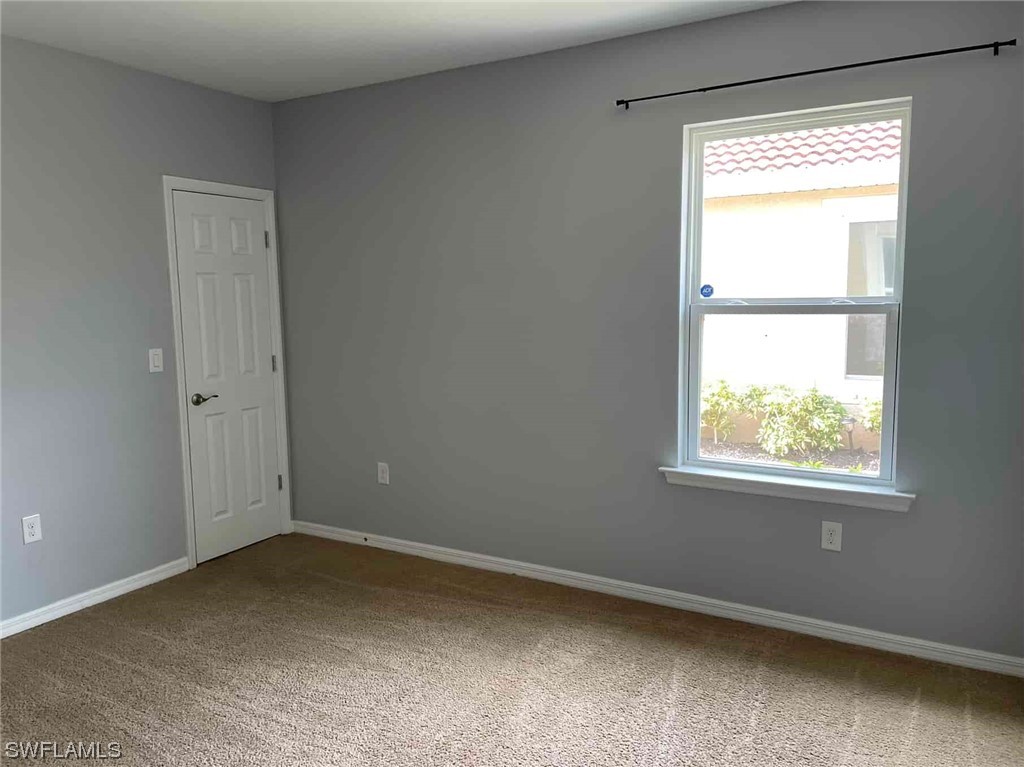 4369 Dutchess Park Road Fort Myers, FL 33916 - Photo 6 of 18 a view of an empty room with a window