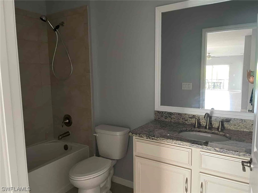 4369 Dutchess Park Road Fort Myers, FL 33916 - Photo 7 of 18 a bathroom with a granite countertop sink a toilet and shower