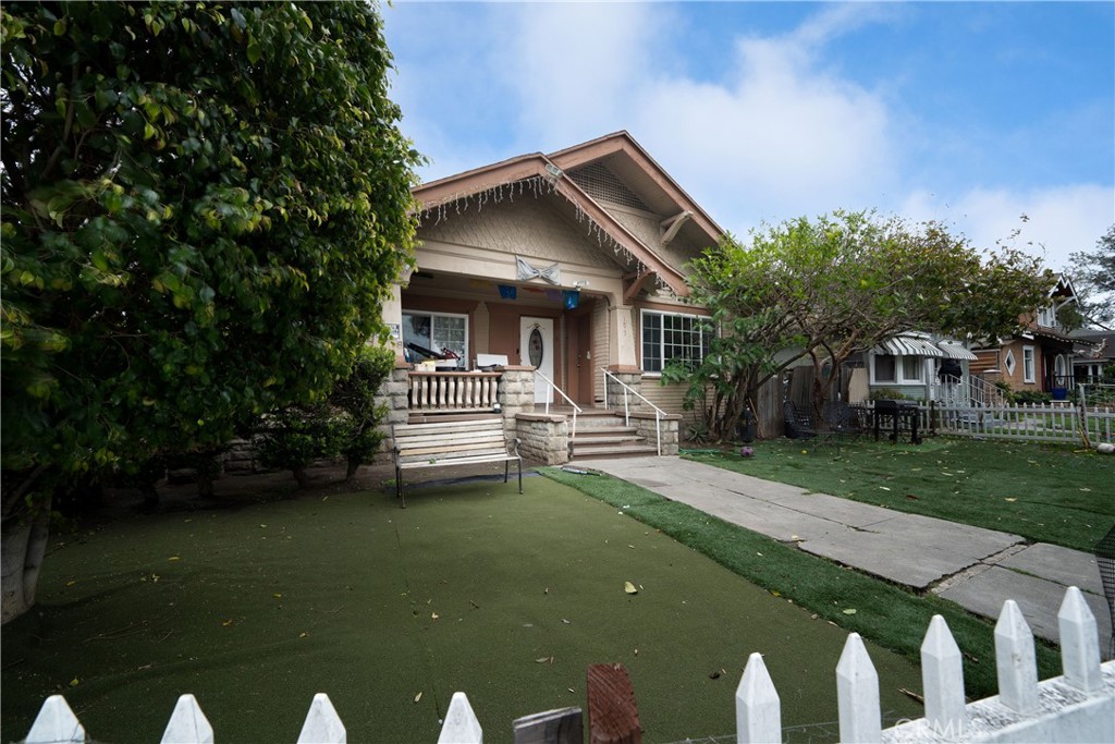 101 South Birch Street Santa Ana, CA 92701 - Photo 2 of 6 a front view of a house with garden