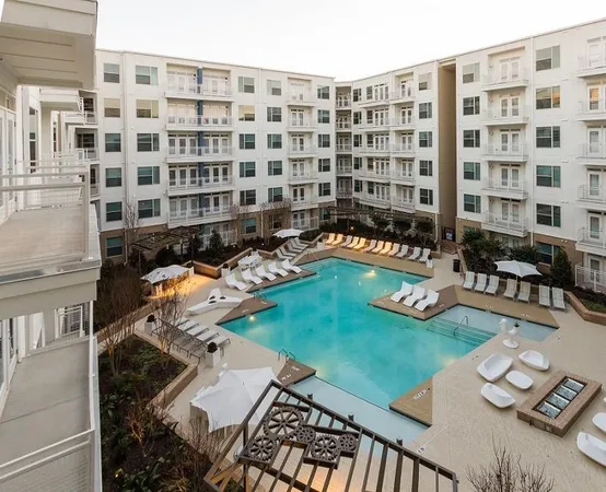a front view of a building with outdoor seating