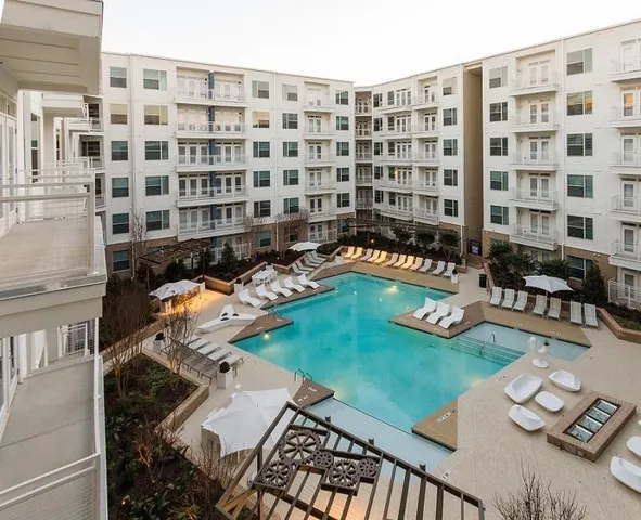 a front view of a building with outdoor seating