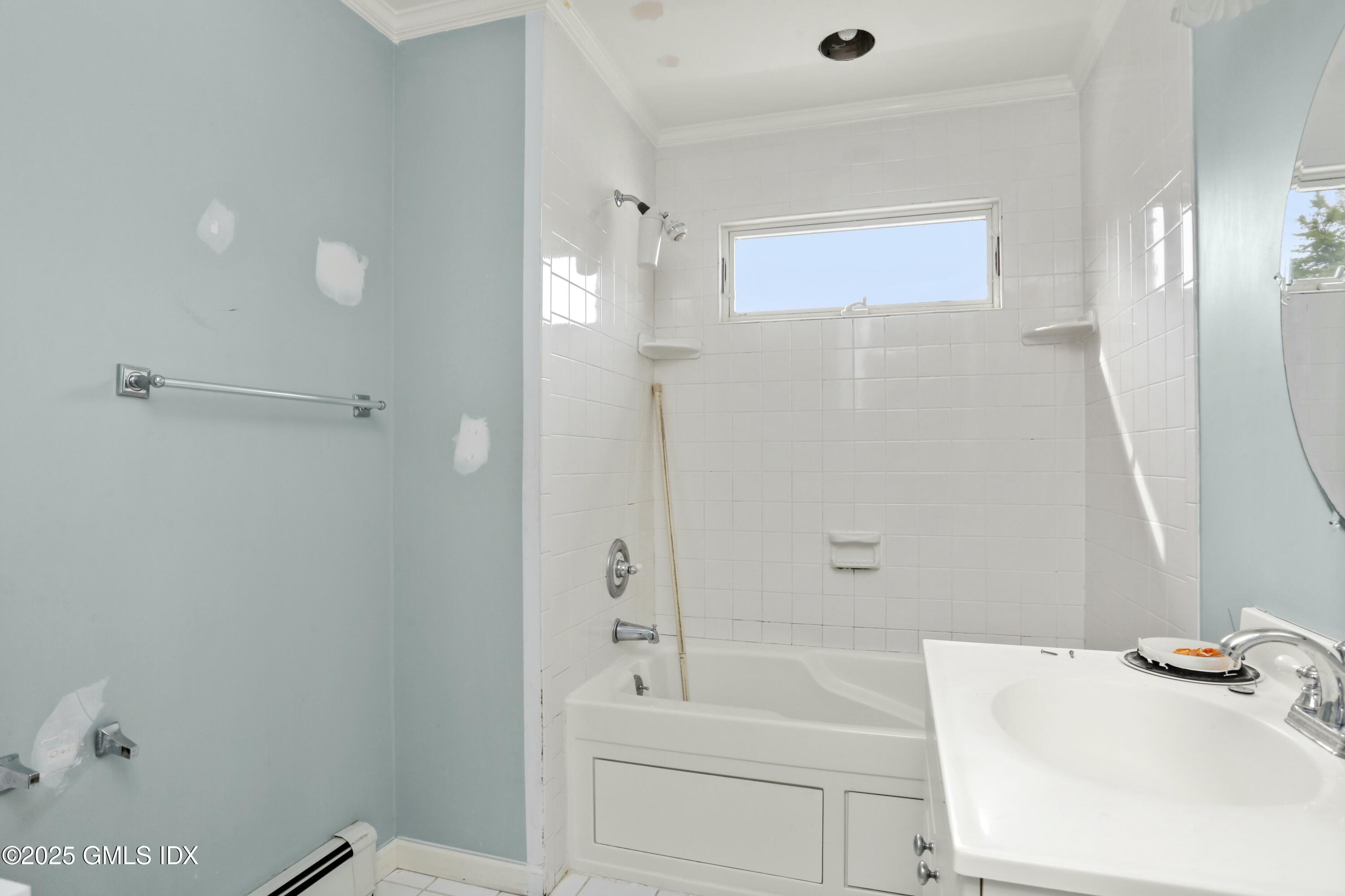 66.5 Prospect Street Greenwich, CT 06830 - Photo 12 of 17 a bathroom with a bathtub and a sink