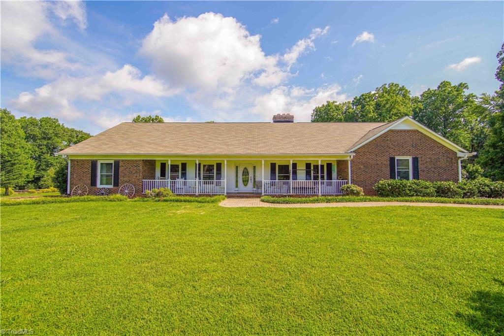5376 Bunch Road Summerfield, NC 27358 - Photo 1 of 45 Fall in love with front porch sitting looking over your large front yard!