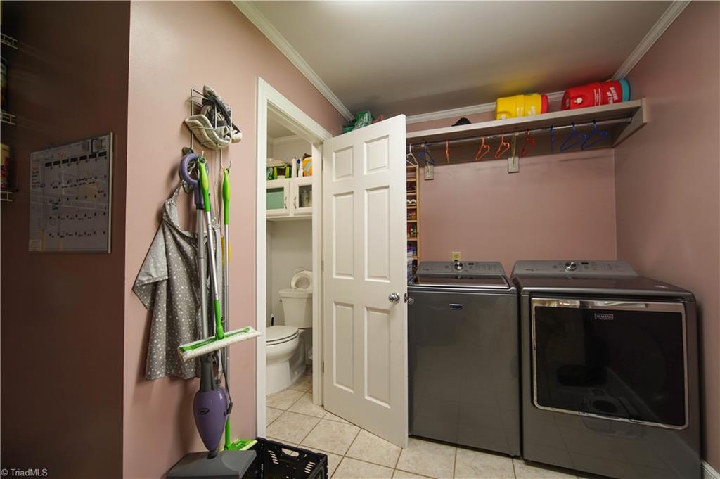 5376 Bunch Road Summerfield, NC 27358 - Photo 14 of 45 Laundry & a half bath on the main floor!