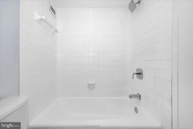 a close up of a bathtub curtain