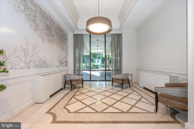 a living room with a table and a large window