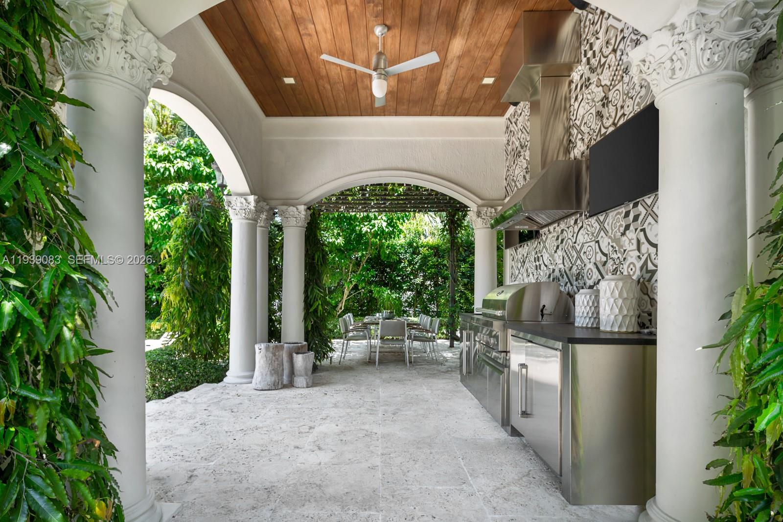 7275 Old Cutler Road Coral Gables, FL 33143 - Photo 15 of 21 a view of a porch with couches next to a yard