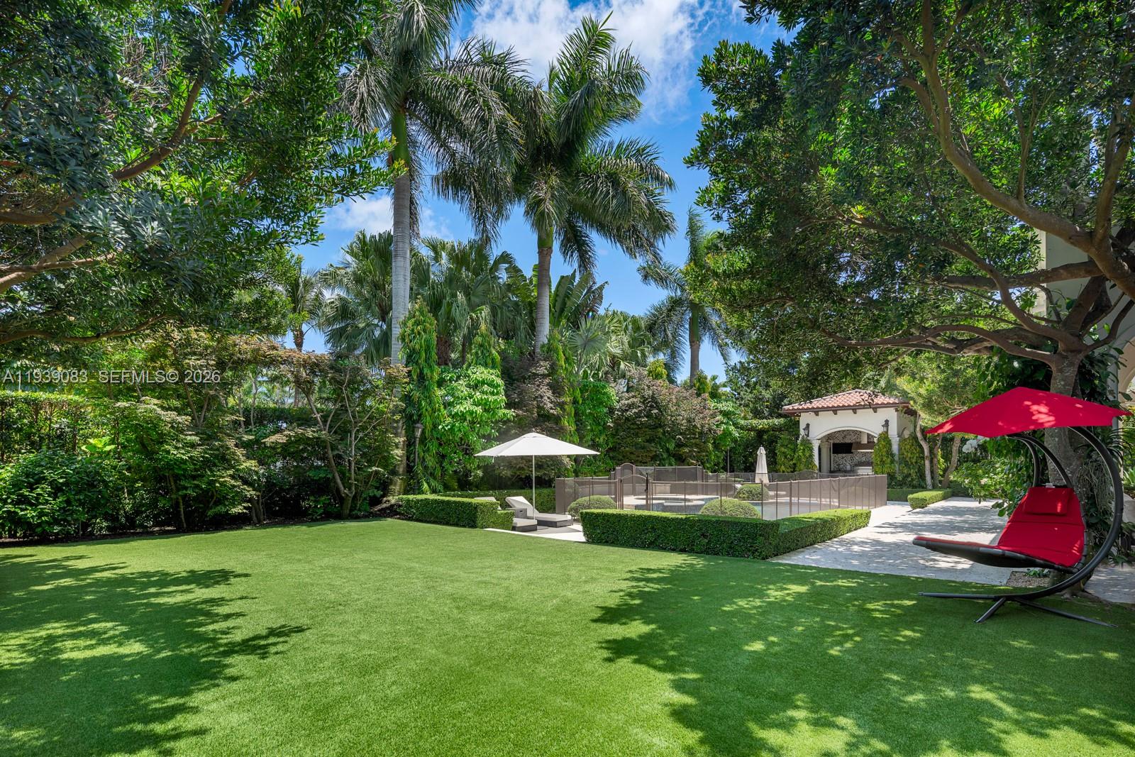 7275 Old Cutler Road Coral Gables, FL 33143 - Photo 17 of 21 a view of a house with a yard