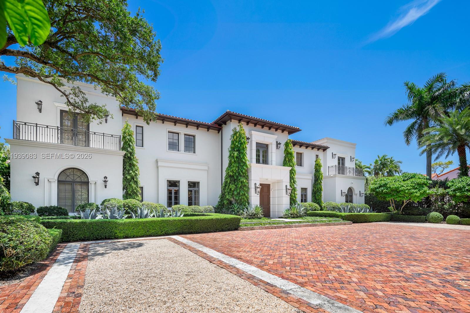 7275 Old Cutler Road Coral Gables, FL 33143 - Photo 2 of 21 a front view of a house with a garden and plants