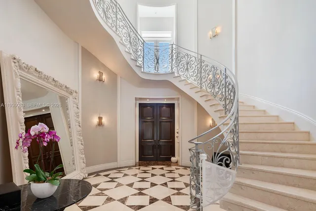 a view of entryway with a front door and wooden floor