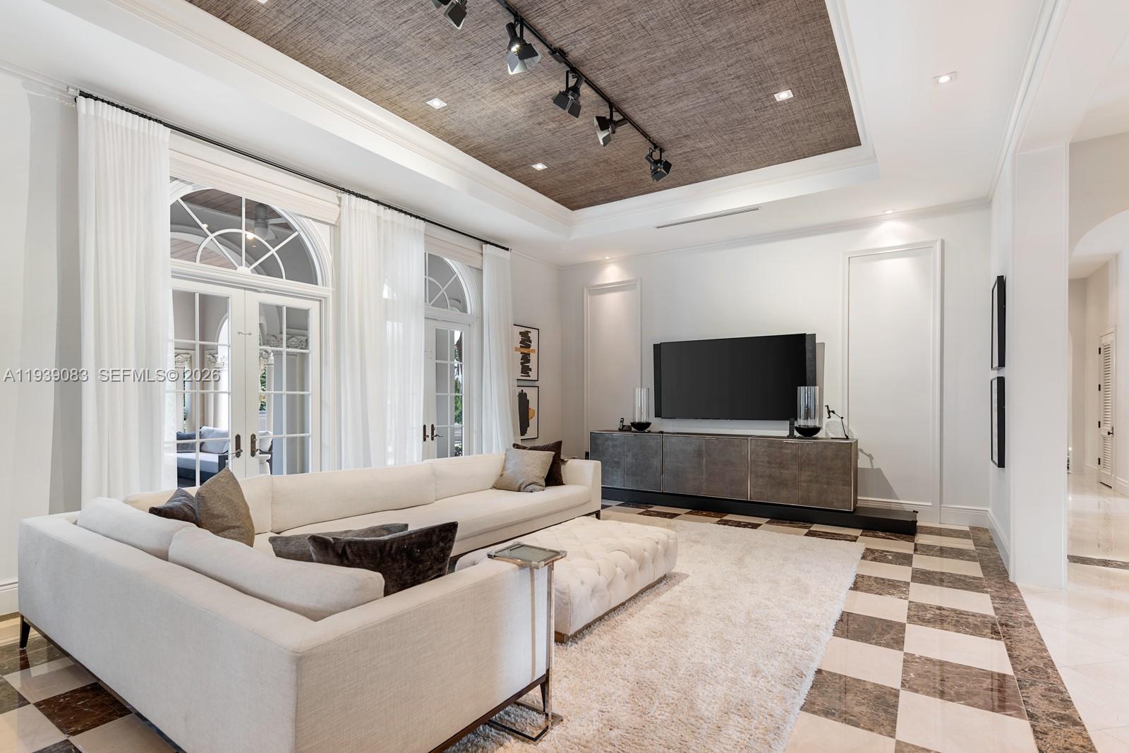 7275 Old Cutler Road Coral Gables, FL 33143 - Photo 6 of 21 a living room with furniture and a flat screen tv