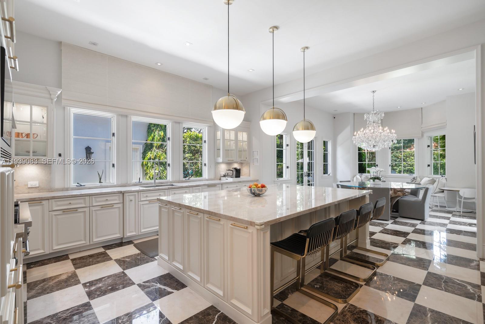 7275 Old Cutler Road Coral Gables, FL 33143 - Photo 7 of 21 a kitchen with counter space sink and chairs