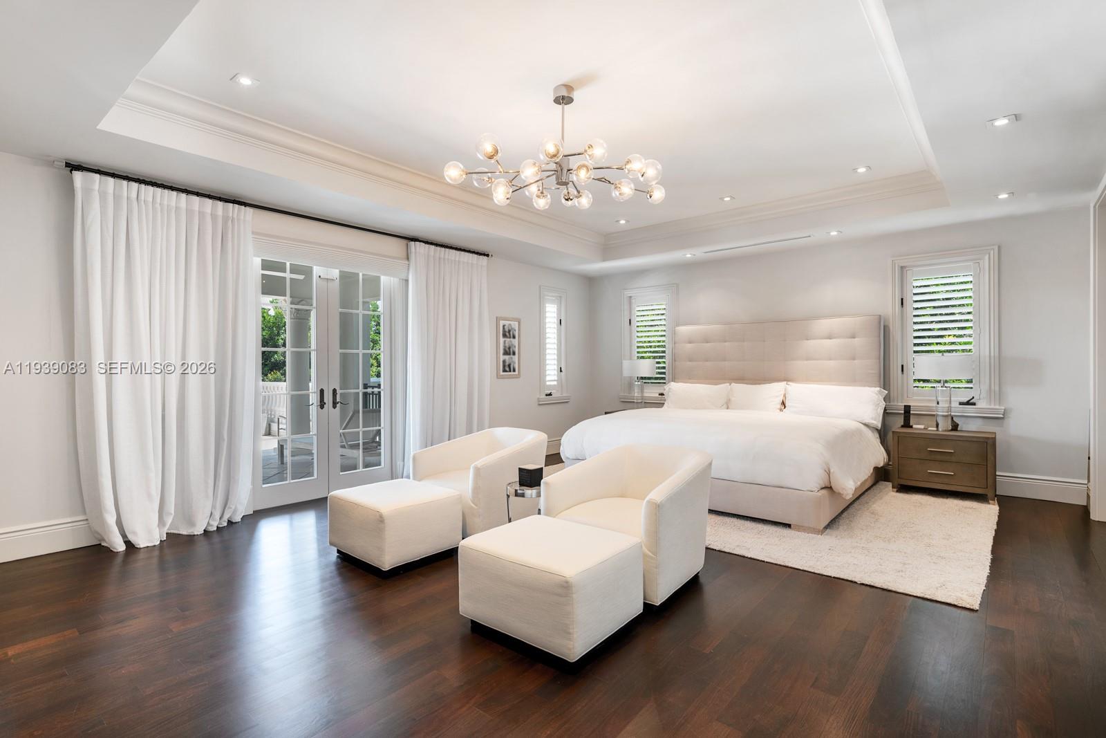 7275 Old Cutler Road Coral Gables, FL 33143 - Photo 9 of 21 a bedroom with bed and wooden floor