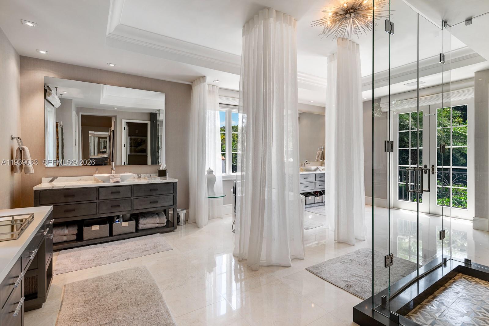 7275 Old Cutler Road Coral Gables, FL 33143 - Photo 10 of 21 a view of a spacious bathroom with a tub and shower