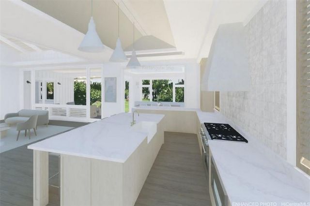 a large white bed in a white room