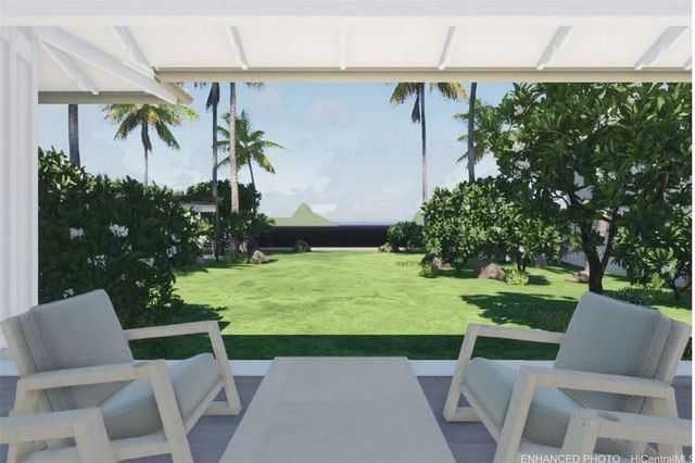 a view of yard with seating area and green space