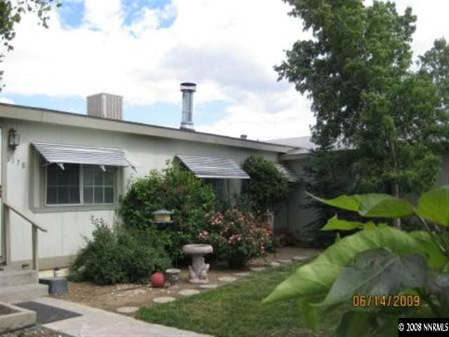 5178 Anchorage Court Reno, NV 89506 - Photo 1 of 9 a front view of a house with garden