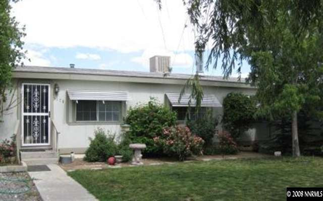 5178 Anchorage Court Reno, NV 89506 - Photo 2 of 9 a front view of a house with a garden