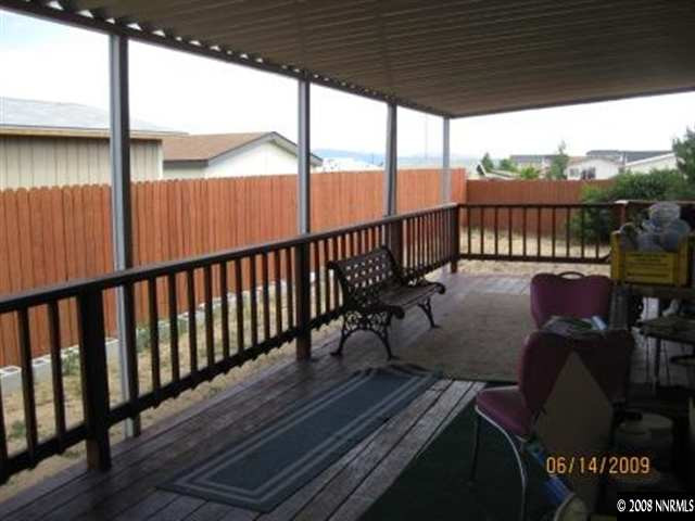 5178 Anchorage Court Reno, NV 89506 - Photo 4 of 9 a view of balcony with wooden floor and outdoor seating