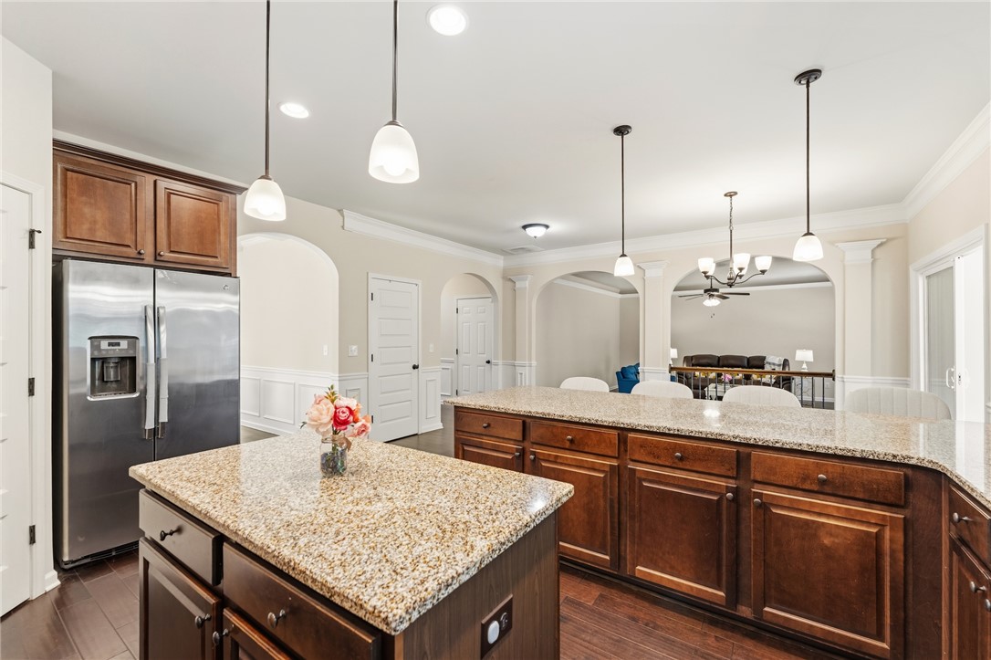5 Tolkien Drive Anderson, SC 29621 - Photo 17 of 36 Gleaming stone countertops and warm wood cabinetry anchor this spacious culinary space.