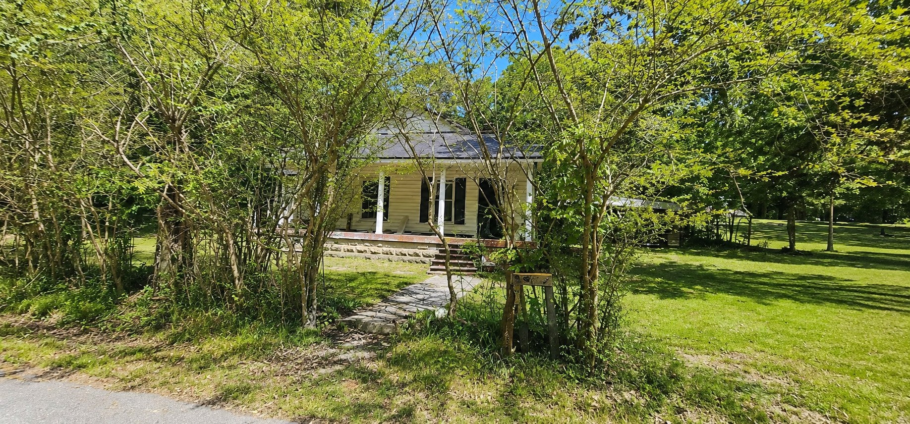 505 Draper Street Paris, TN 38242 - Photo 1 of 11 a front view of a house with a yard
