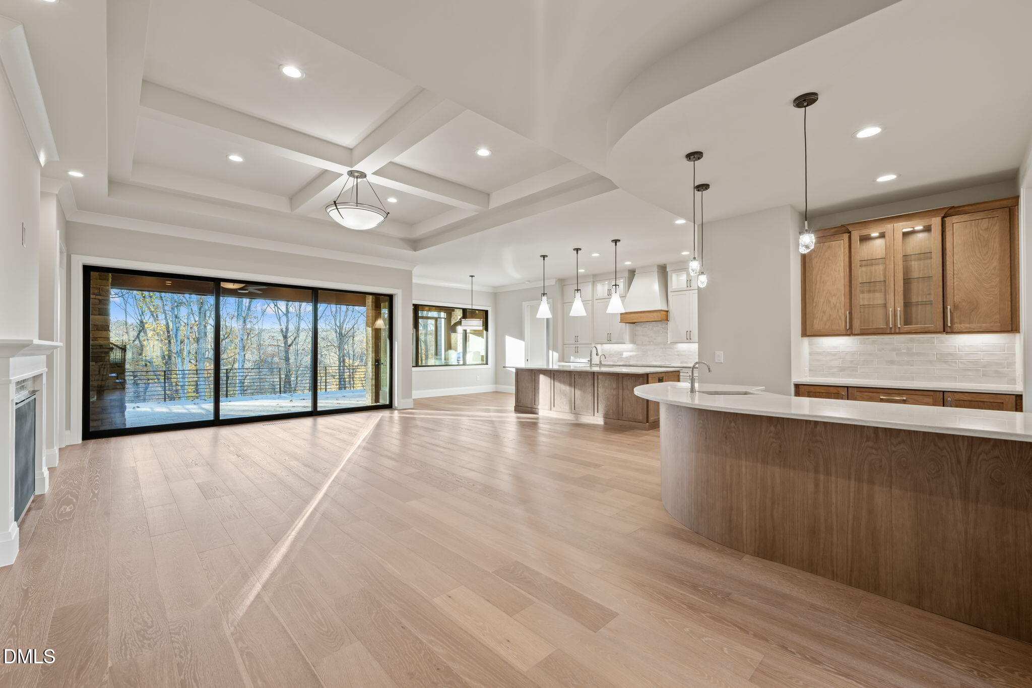 9125 Overlook Crest Drive Wake Forest, NC 27587 - Photo 11 of 54 a view of an empty room and kitchen with granite countertop a stove top oven