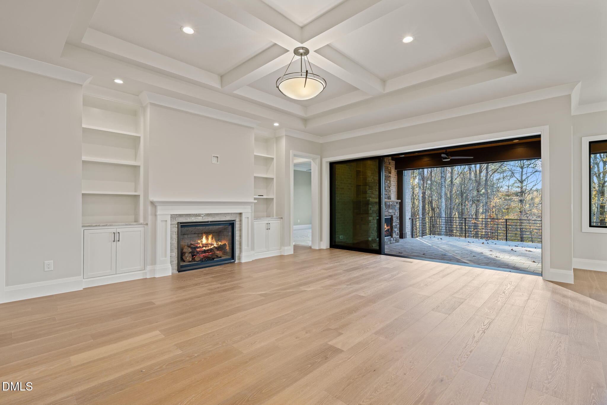 9125 Overlook Crest Drive Wake Forest, NC 27587 - Photo 16 of 54 a view of an empty room with a fireplace and a window