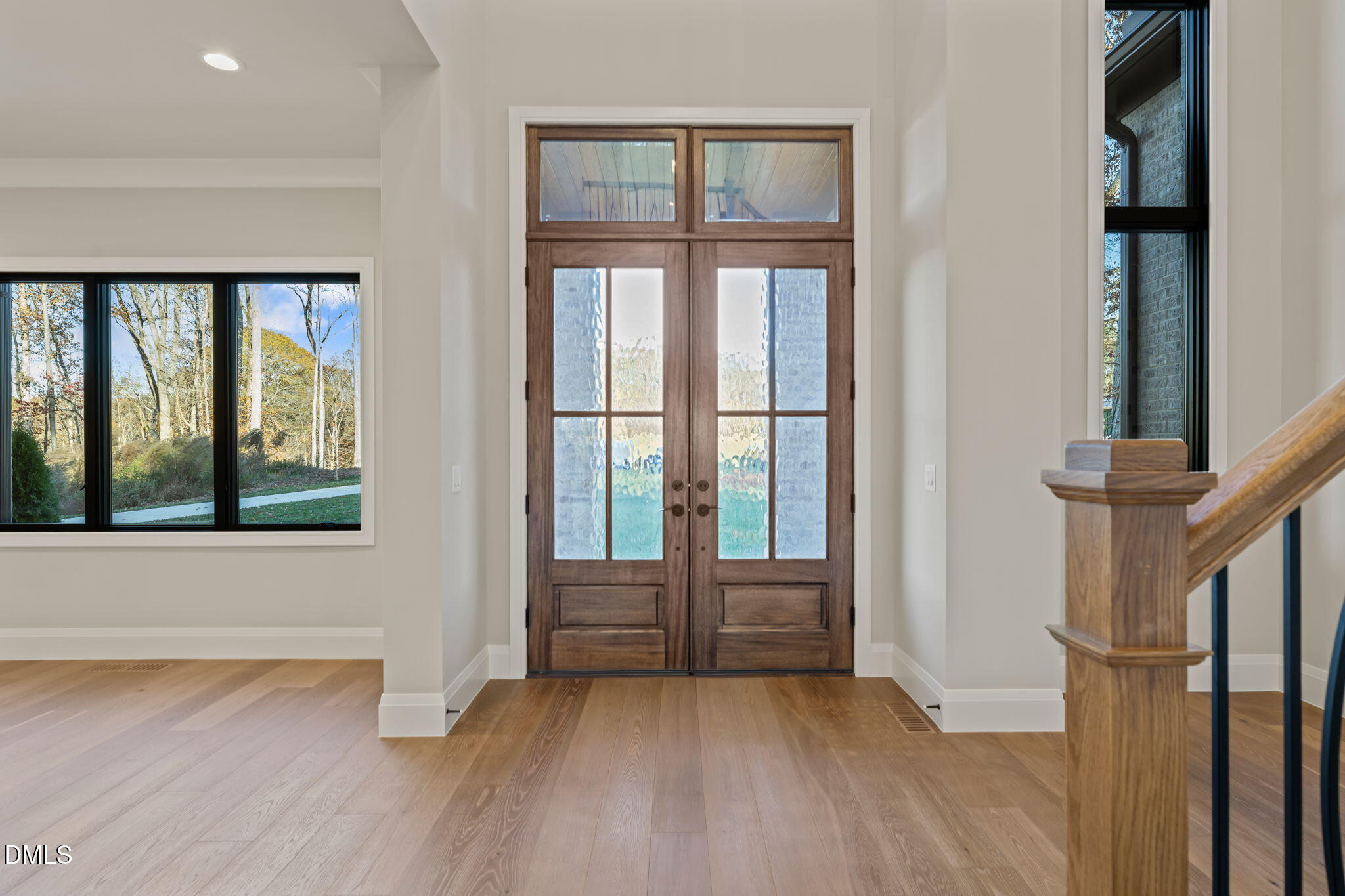 9125 Overlook Crest Drive Wake Forest, NC 27587 - Photo 2 of 54 an empty room with wooden floor and windows