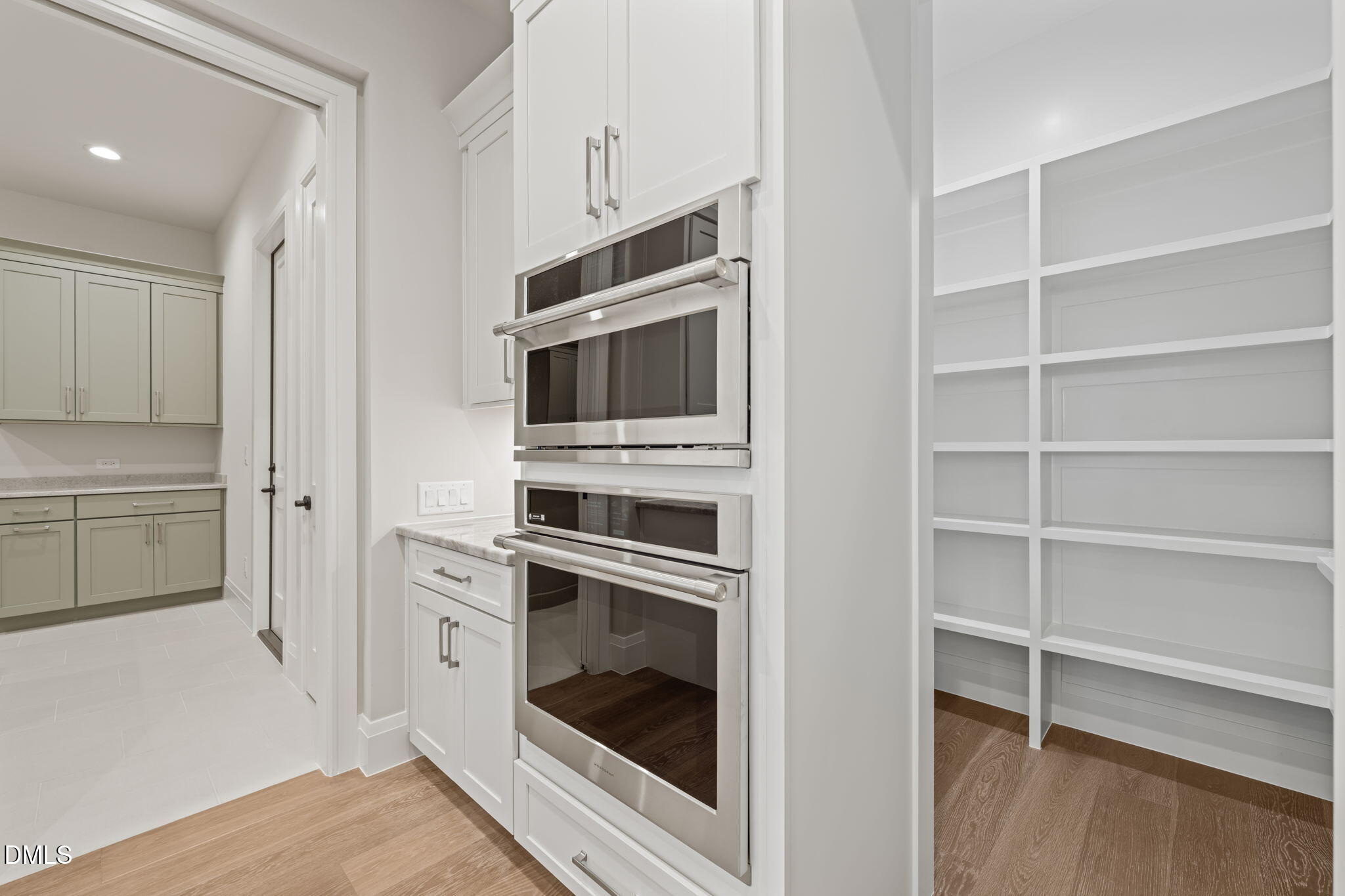 9125 Overlook Crest Drive Wake Forest, NC 27587 - Photo 24 of 54 a kitchen with cabinets and stainless steel appliances