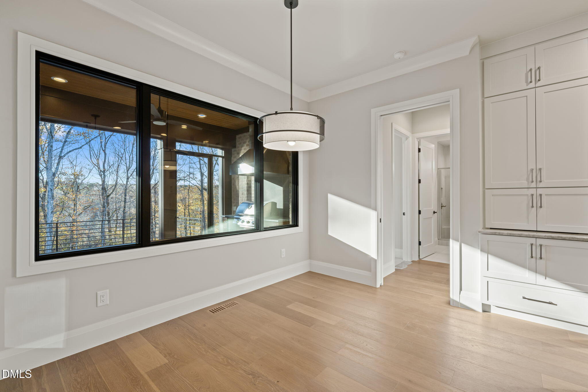 9125 Overlook Crest Drive Wake Forest, NC 27587 - Photo 25 of 54 a view of a hallway with windows and chandelier