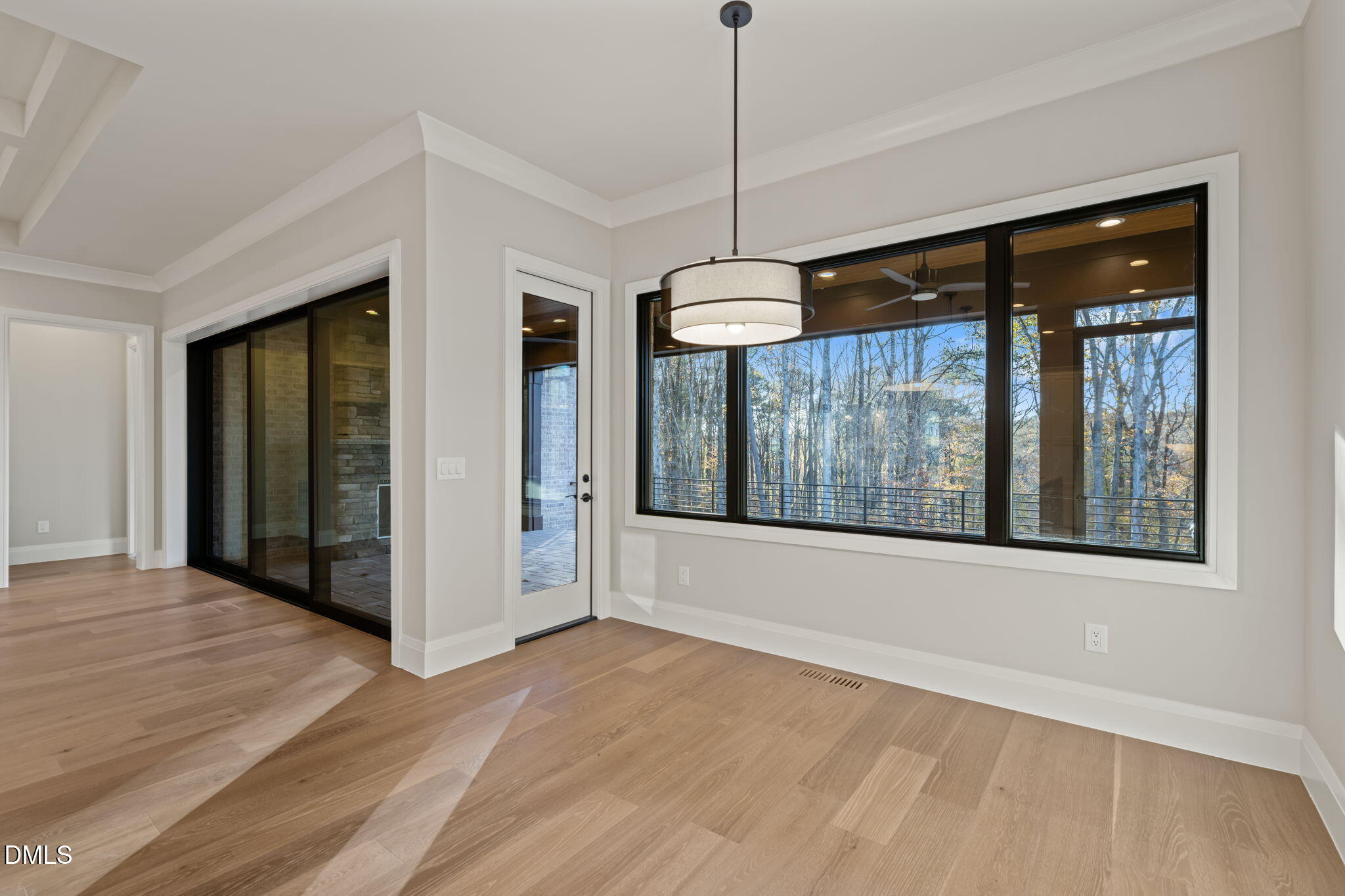 9125 Overlook Crest Drive Wake Forest, NC 27587 - Photo 26 of 54 a view of an empty room with glass door and a window
