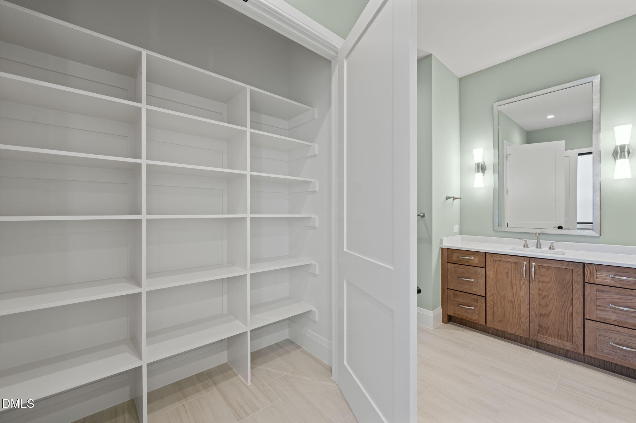 9125 Overlook Crest Drive Wake Forest, NC 27587 - Photo 34 of 54 a spacious bathroom with a double vanity sink and a mirror
