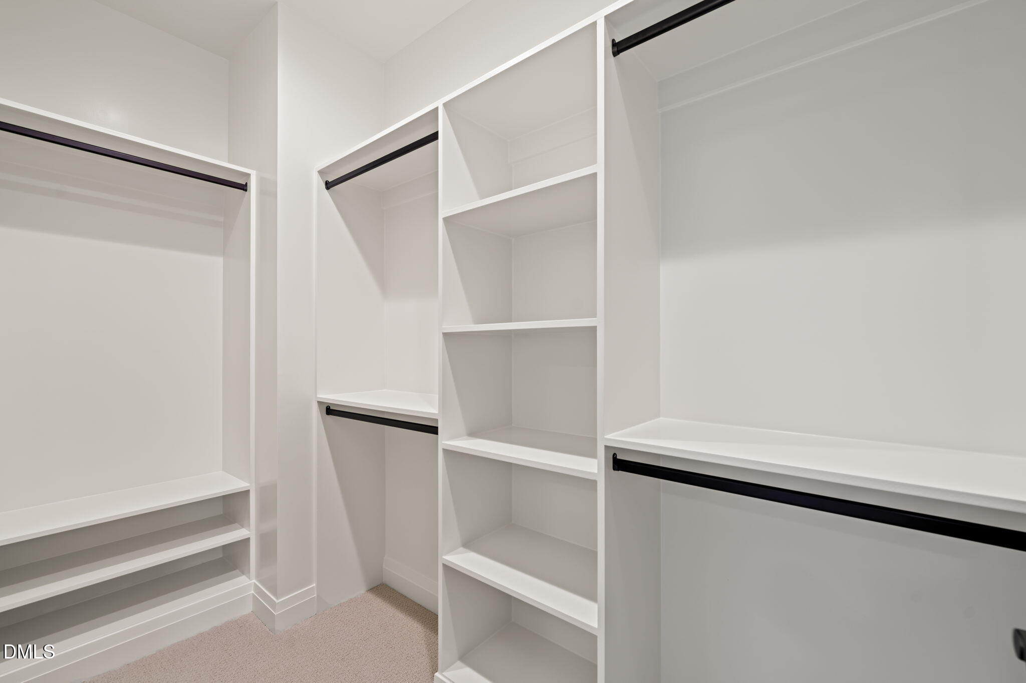9125 Overlook Crest Drive Wake Forest, NC 27587 - Photo 42 of 54 a view of walk in closet with empty racks