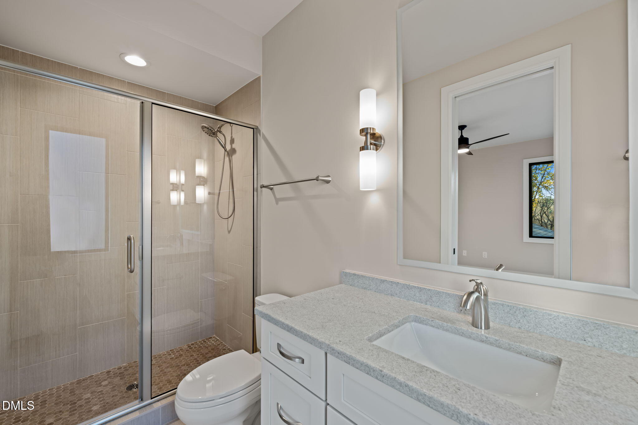 9125 Overlook Crest Drive Wake Forest, NC 27587 - Photo 43 of 54 a bathroom with a sink toilet vanity and shower