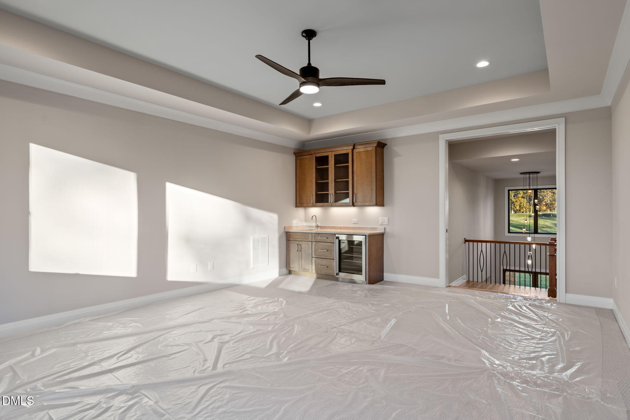 9125 Overlook Crest Drive Wake Forest, NC 27587 - Photo 45 of 54 a view of a livingroom with a chandelier fan and windows