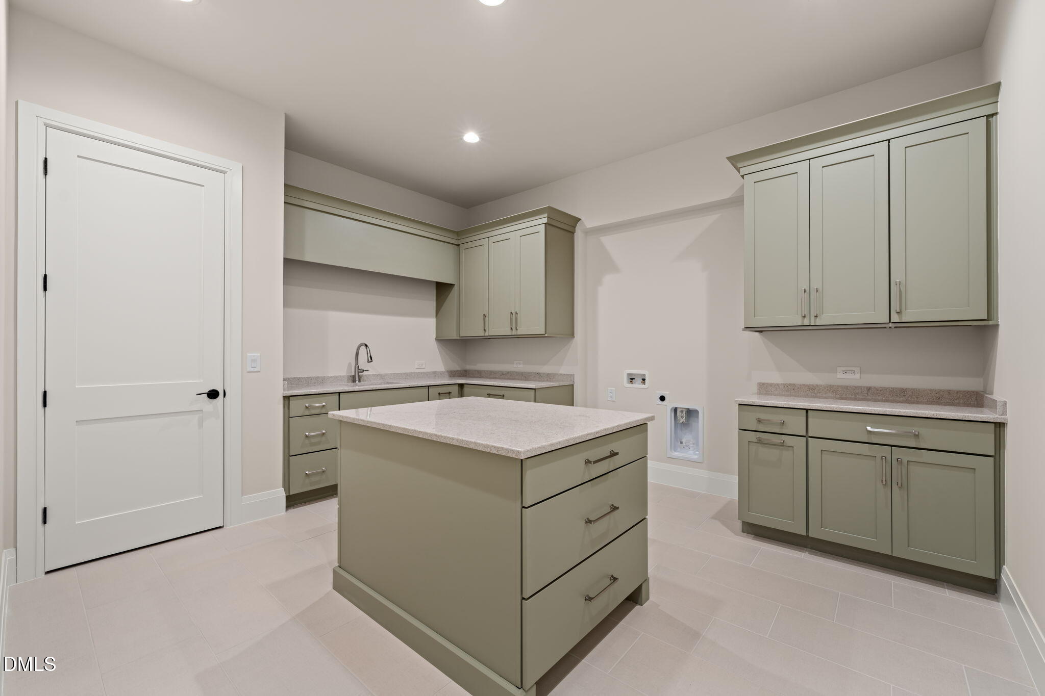 9125 Overlook Crest Drive Wake Forest, NC 27587 - Photo 49 of 54 a kitchen with a stove top oven sink and cabinets