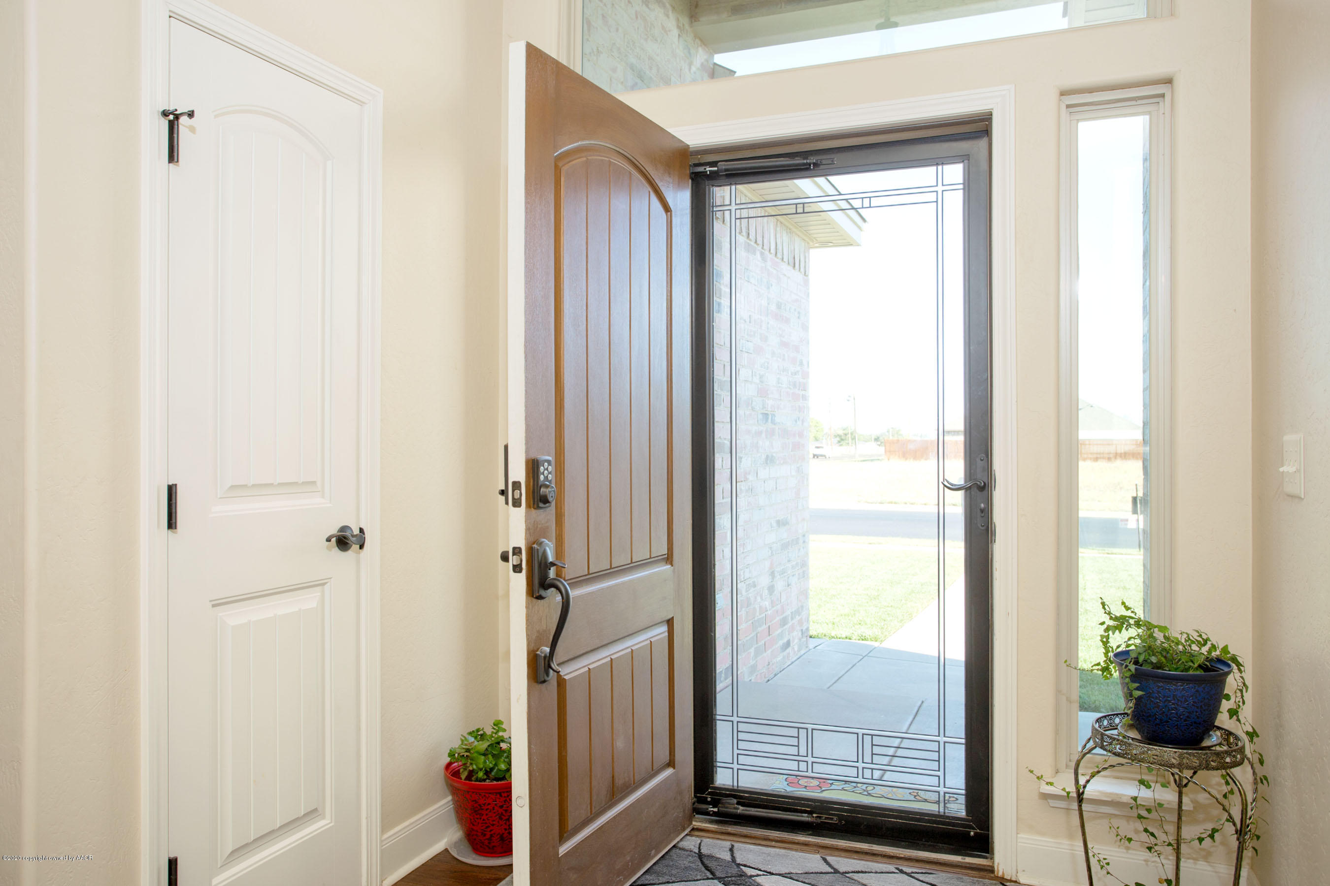 3917 Arden Road Amarillo, TX 79118 - Photo 2 of 17 a view of entryway with wooden floor and windows