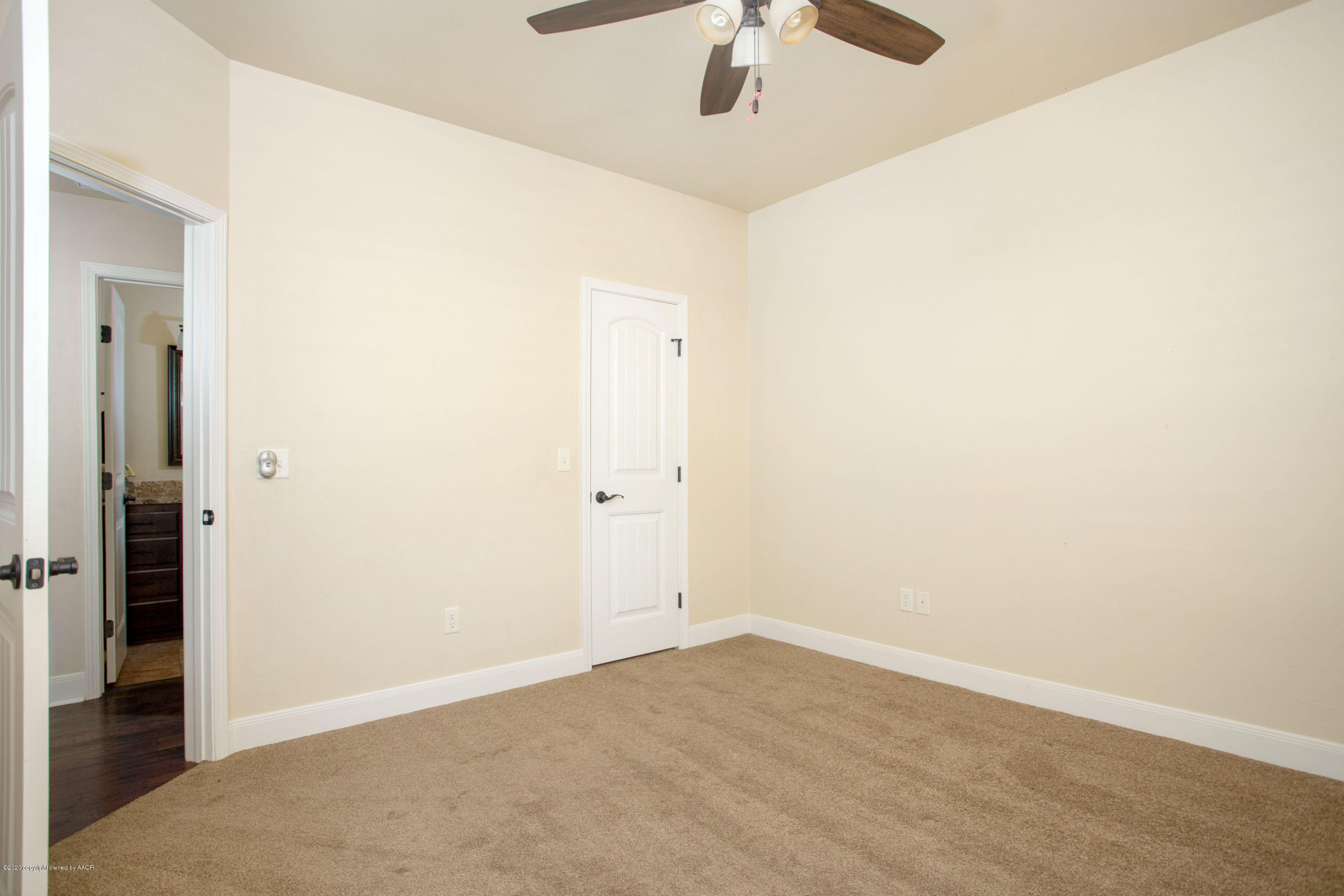 3917 Arden Road Amarillo, TX 79118 - Photo 12 of 17 an empty room with a fan & a ceiling fan