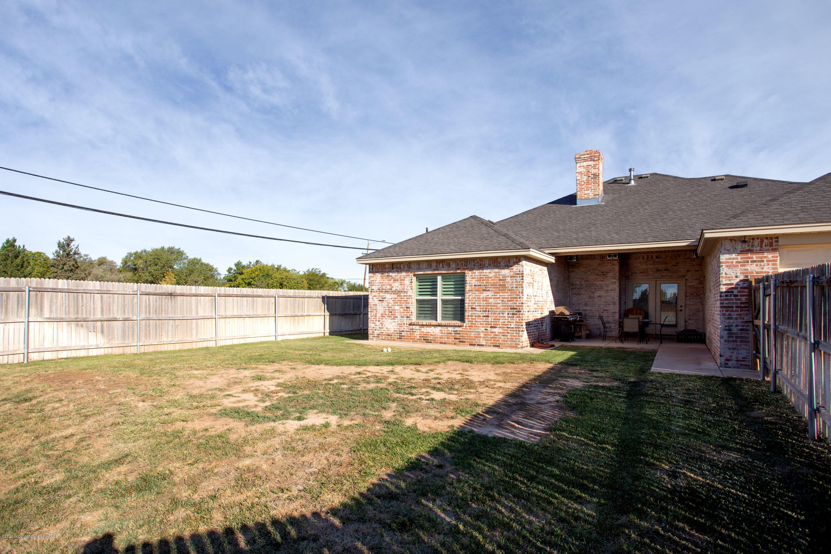 3917 Arden Road Amarillo, TX 79118 - Photo 15 of 17 a view of a house with a yard and sitting area