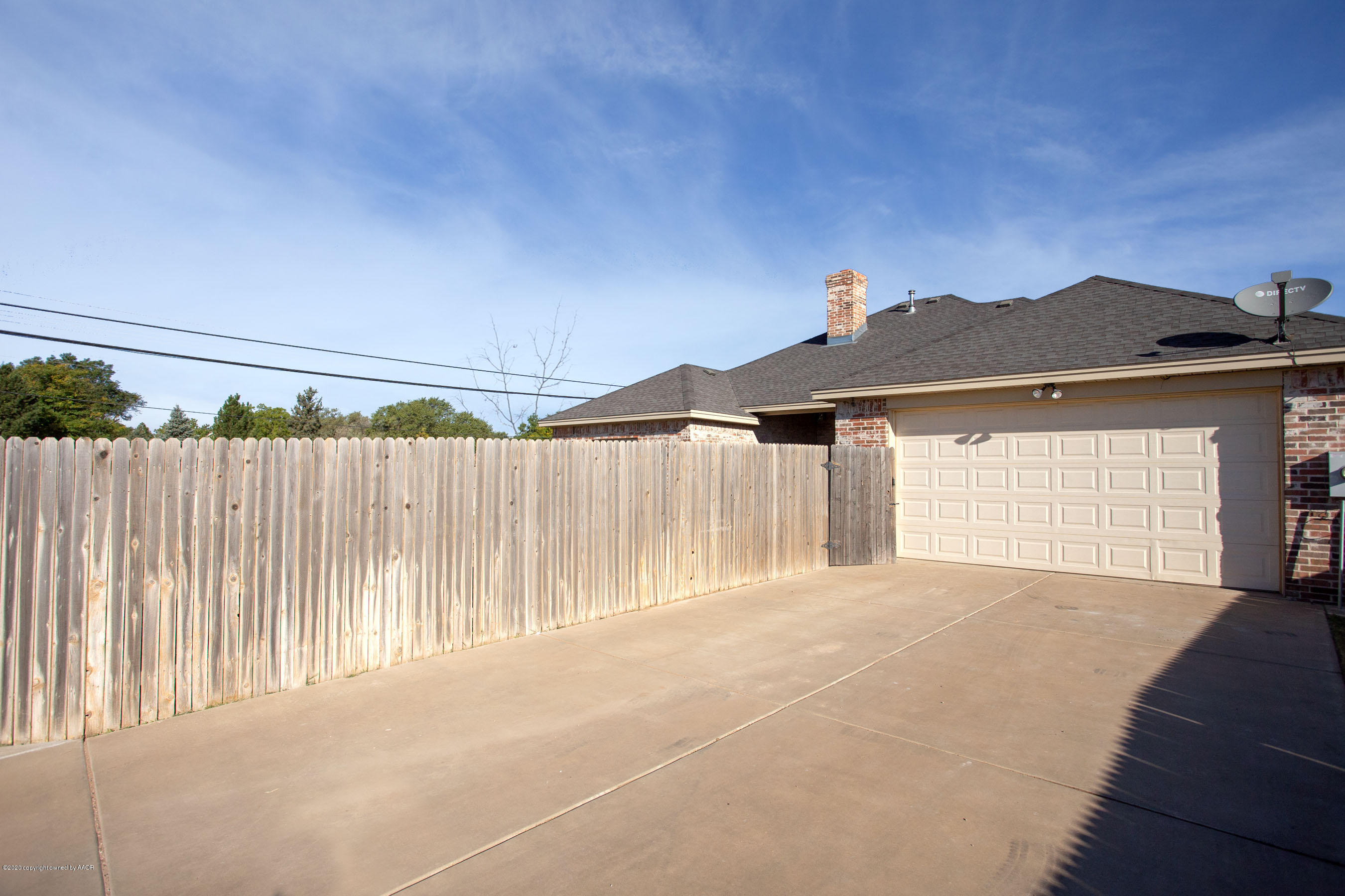3917 Arden Road Amarillo, TX 79118 - Photo 16 of 17 a front view of a house with a garage