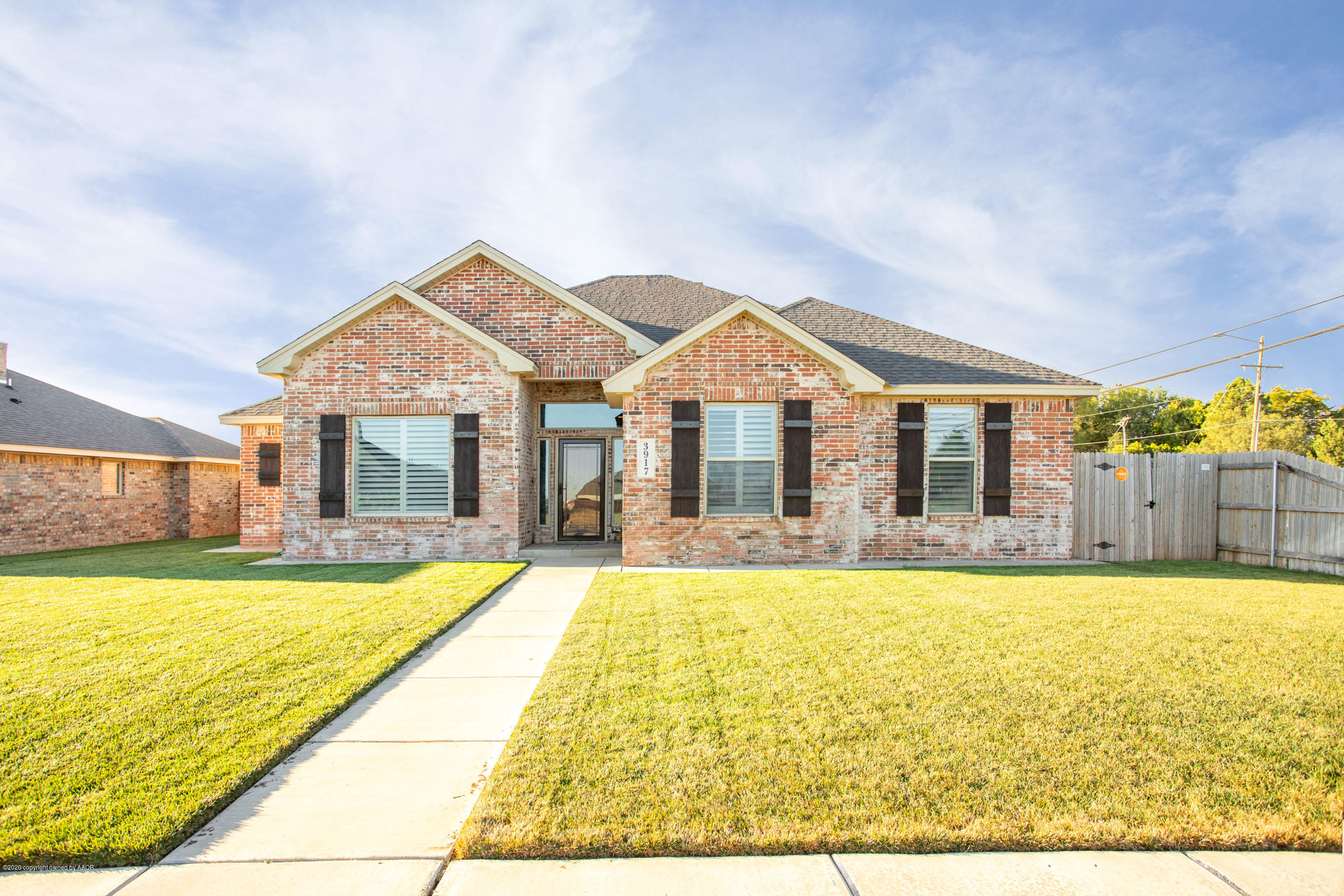 3917 Arden Road Amarillo, TX 79118 - Photo 17 of 17 a view of a house with swimming pool and a yard
