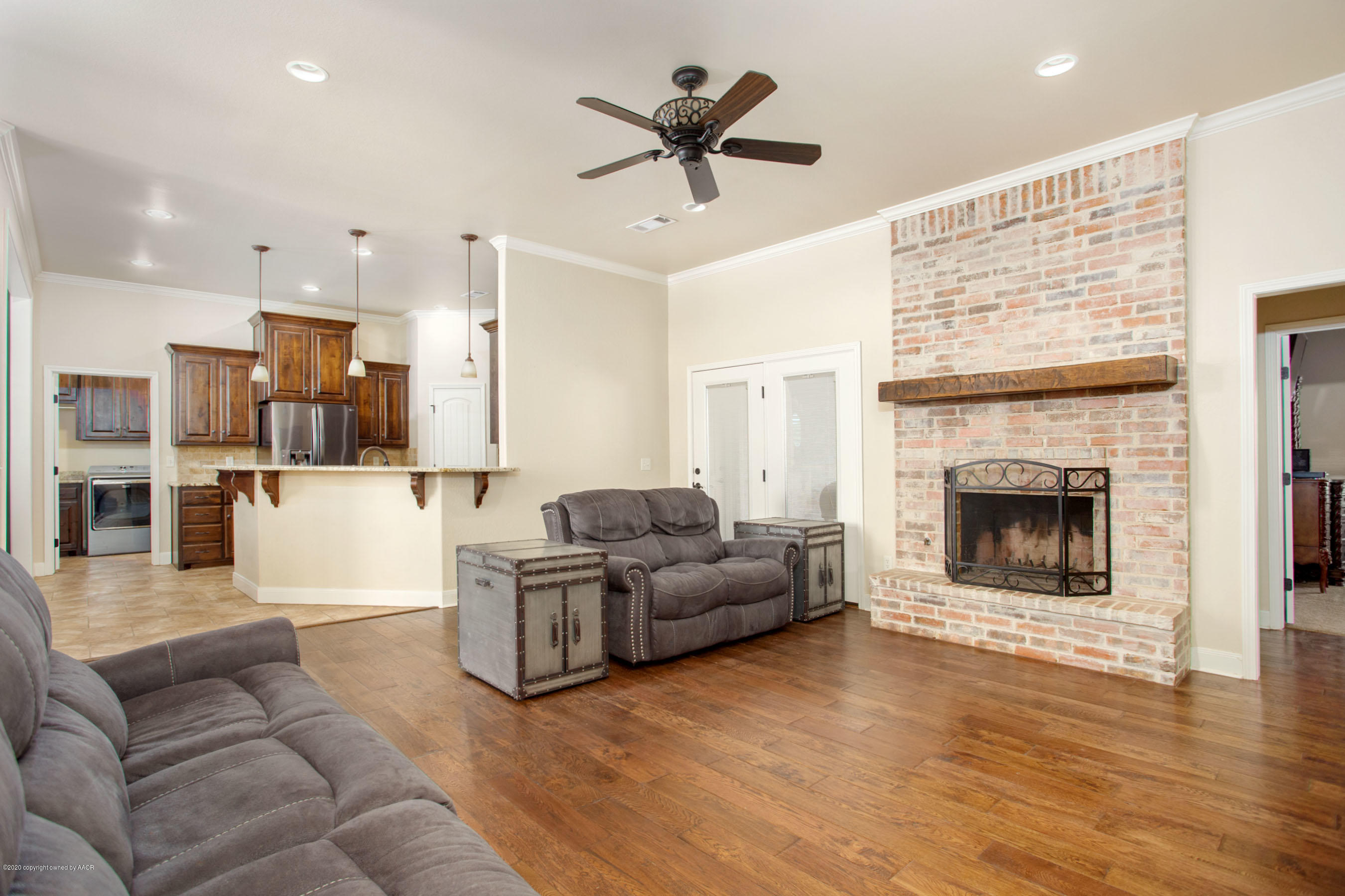 3917 Arden Road Amarillo, TX 79118 - Photo 3 of 17 a living room with furniture and a fireplace
